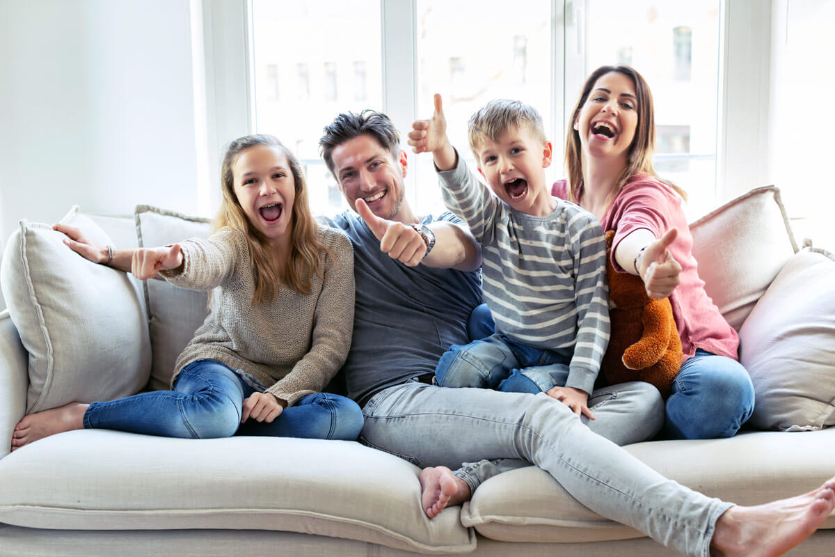 Happy-Family-Thumbs-Up-Indoors